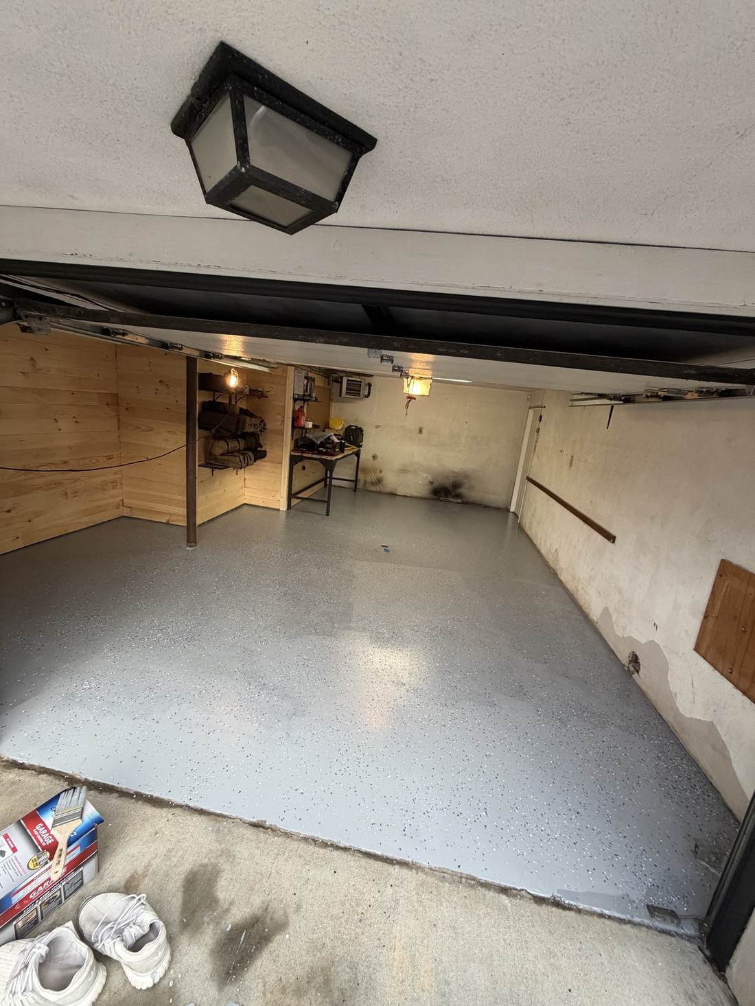 Same garage floor finished with a grey flecked epoxy coating