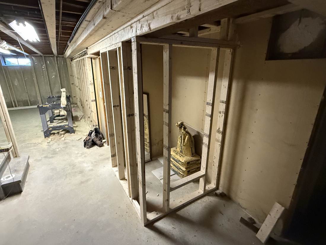 Framed closet nook in a basement remodel
