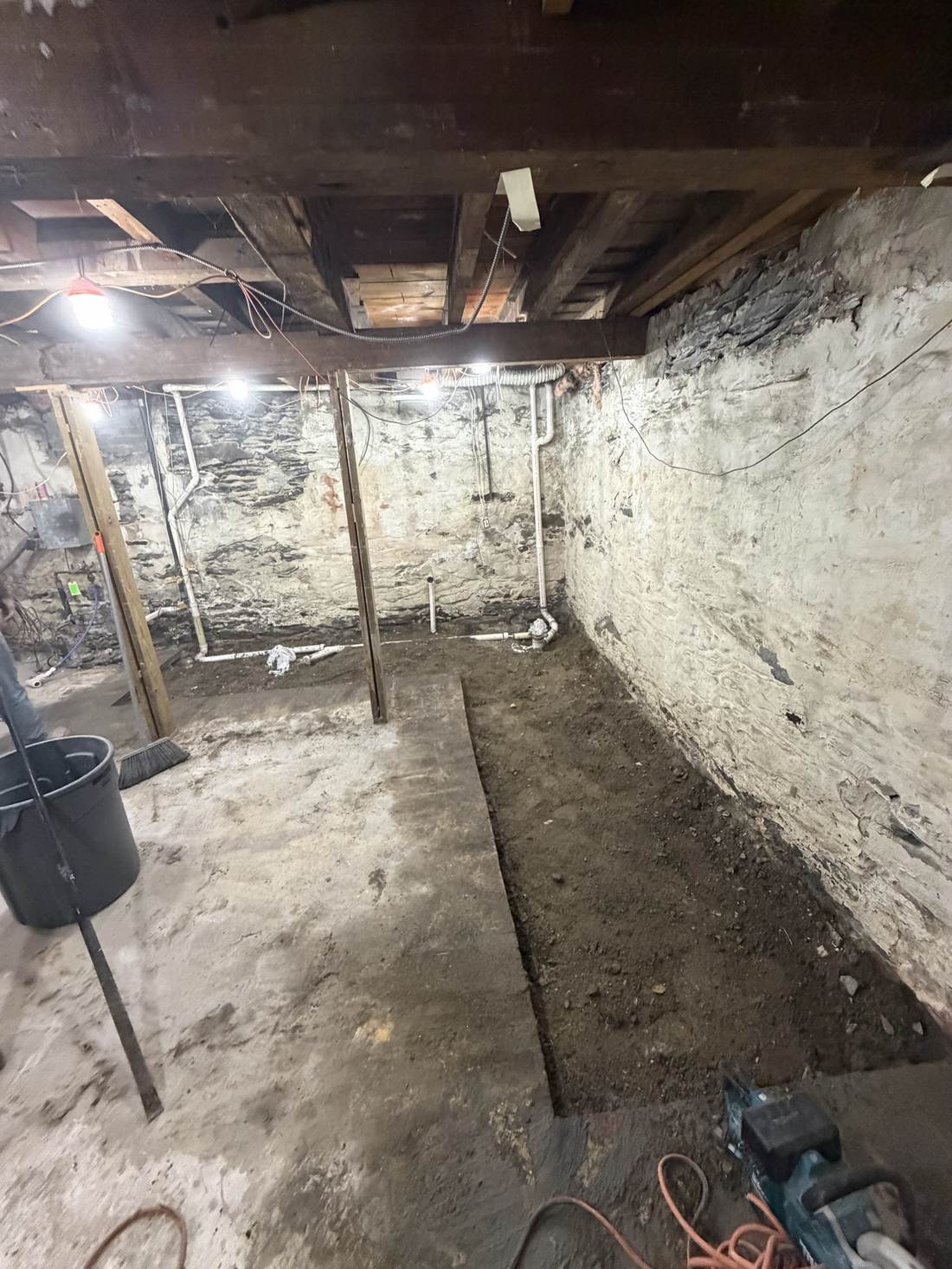 Basement floor prepped along the perimeter wall
