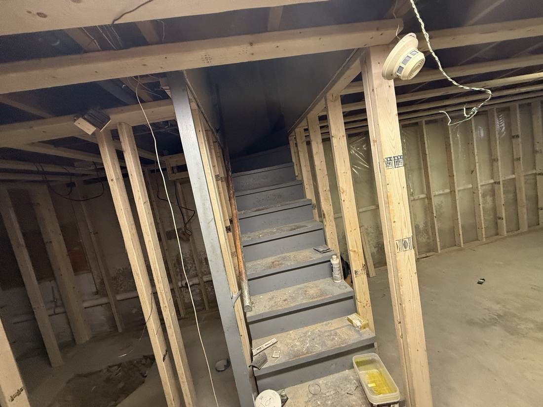 Basement stairway newly framed with painted treads