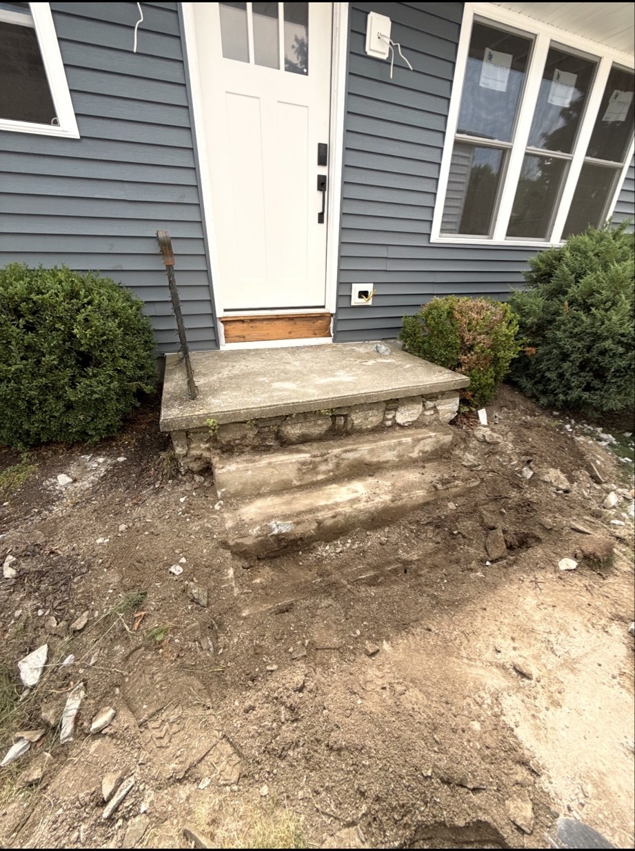 Worn concrete front entry steps before removal