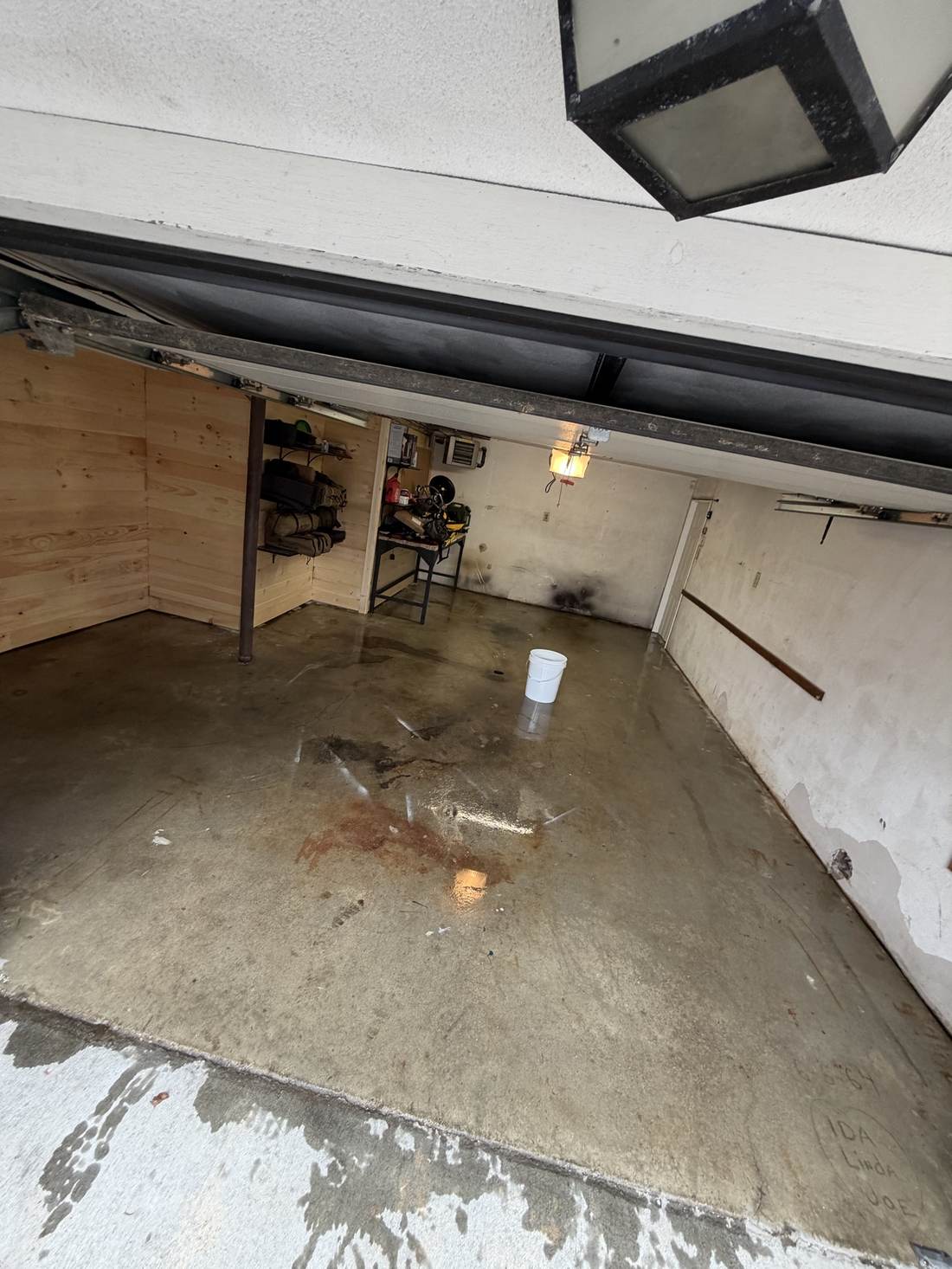 Bare, worn concrete garage floor before coating